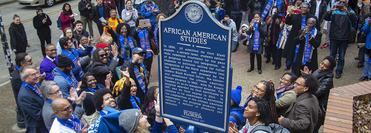 Crowd of people gathered around an African American Studies sign